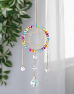 Woven rainbow dream catcher